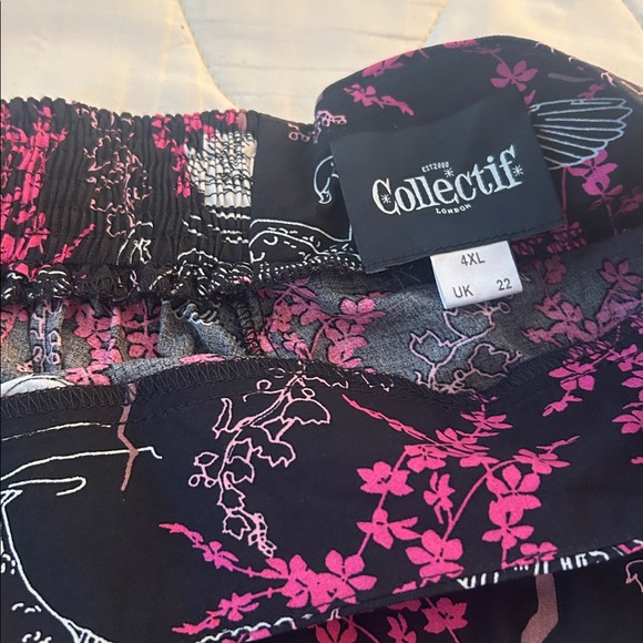 Collectif Black Skirt with Pink Floral and Swan Design - Picture 3 of 4